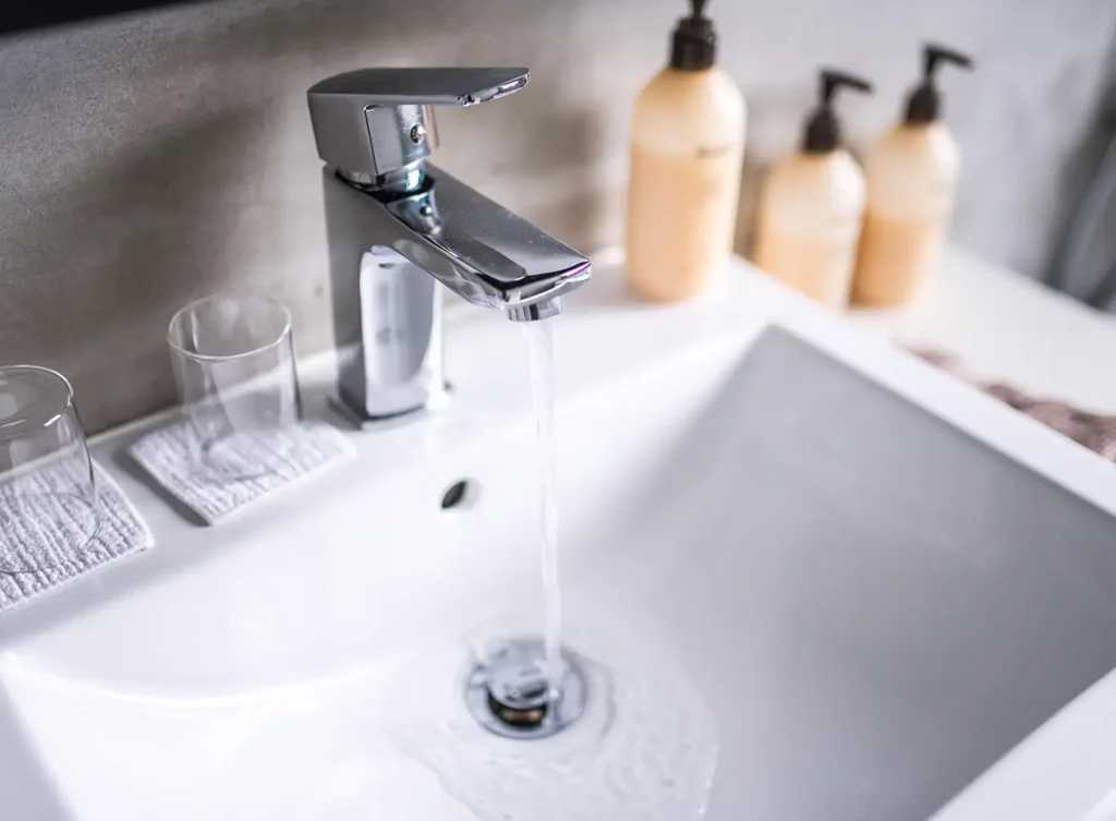 a bathroom sink drain flowing smoothly after professional drain cleaning services were performed on it alton illinois